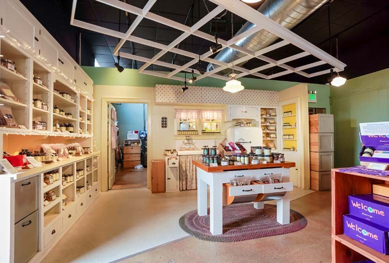 Inside Penzeys Spices: shelves of jars and a kitchen-style display table